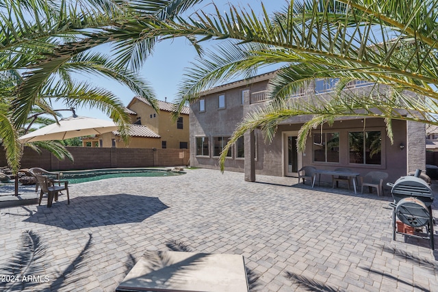 view of swimming pool with a patio