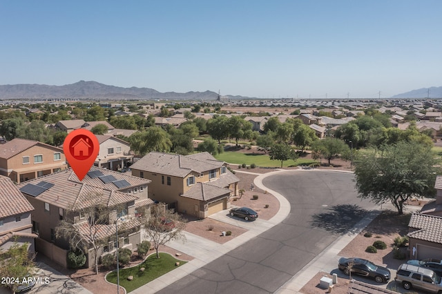 birds eye view of property featuring a mountain view