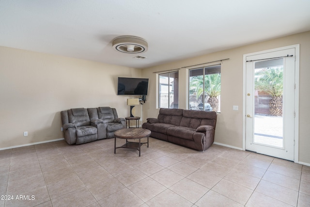 living room with light tile patterned floors and a wealth of natural light