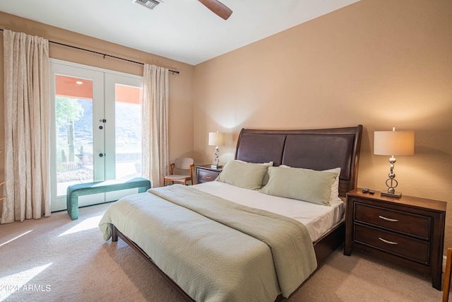 bedroom featuring ceiling fan, light colored carpet, french doors, and access to outside