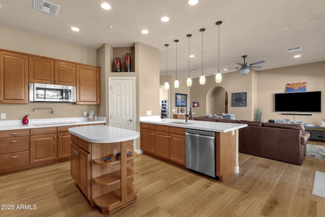 10254 N Demaret Dr, Fountain Hills, AZ 85268 - kitchen with hanging light fixtures, appliances with stainless steel finishes, sink, and a center island with sink