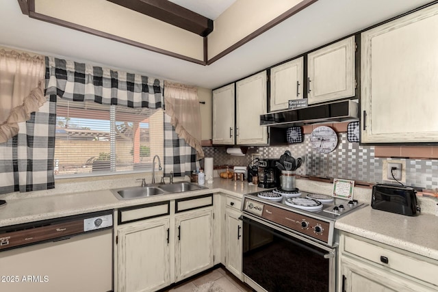 kitchen featuring range with electric cooktop, under cabinet range hood, dishwasher, light countertops, and a sink