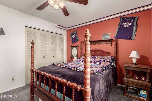 carpeted bedroom with a closet, baseboards, and a ceiling fan