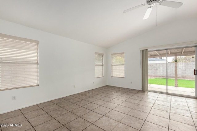 tiled empty room featuring ceiling fan and lofted ceiling