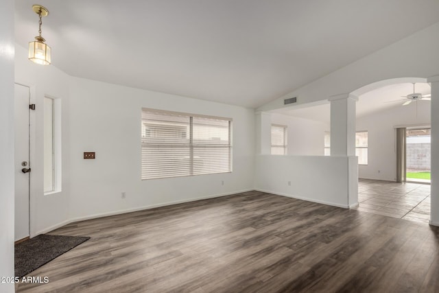 interior space with ceiling fan, dark hardwood / wood-style flooring, and lofted ceiling