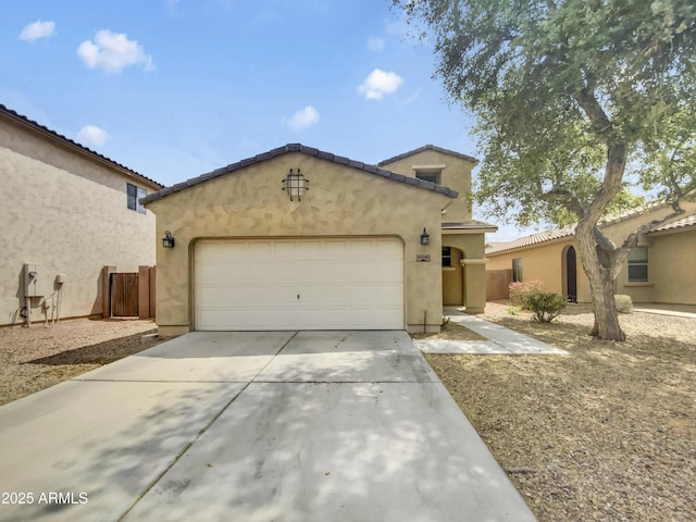 view of front of house with a garage, concrete driveway, and stucco siding