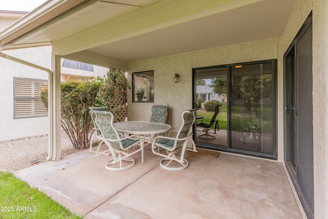 view of patio featuring outdoor dining area