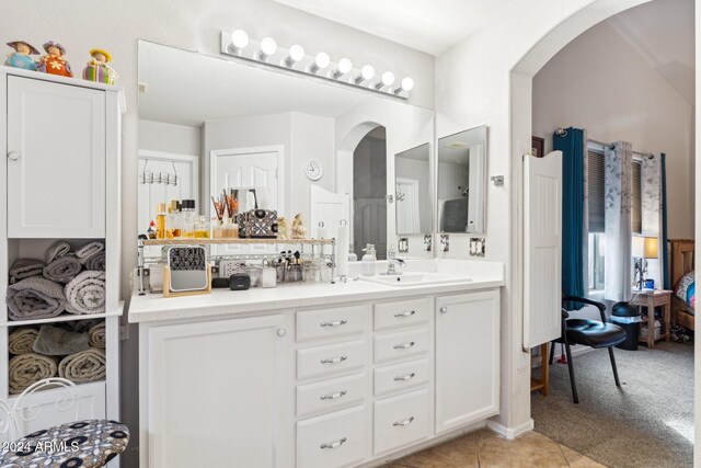 bathroom with tile patterned flooring and vanity