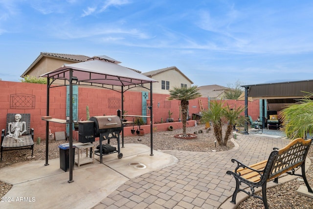 view of patio with a gazebo and a grill