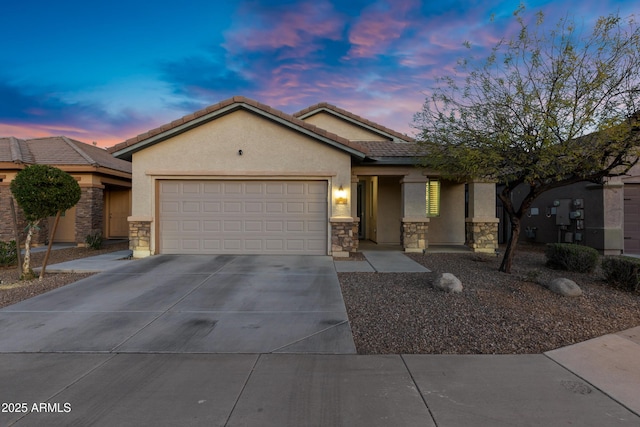 ranch-style house with an attached garage, stucco siding, concrete driveway, stone siding, and a tiled roof