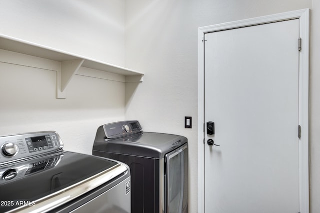 laundry room with washer and clothes dryer and laundry area