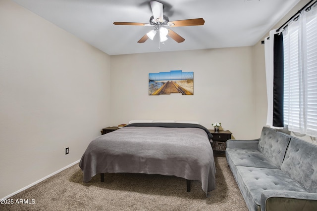 bedroom with a ceiling fan, carpet, and baseboards