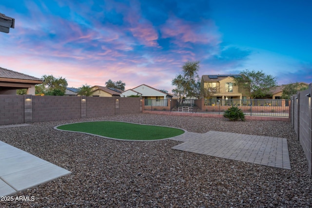 view of yard with a patio and a fenced backyard