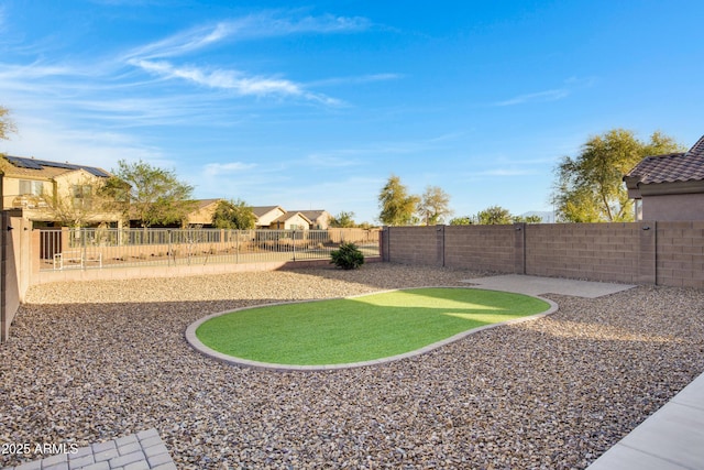 view of yard with a fenced backyard