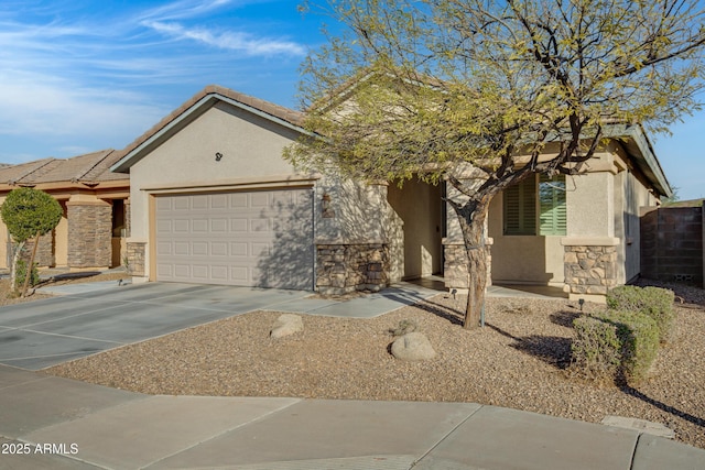 view of front facade featuring driveway, an attached garage, stucco siding, stone siding, and a tiled roof