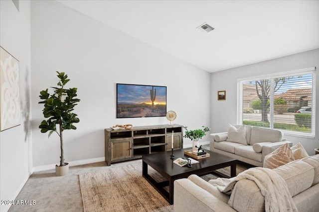 living room featuring vaulted ceiling