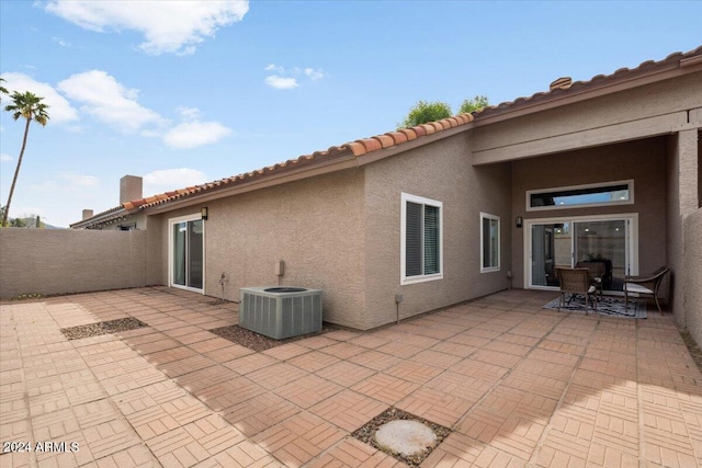 back of house featuring a patio area and central AC unit