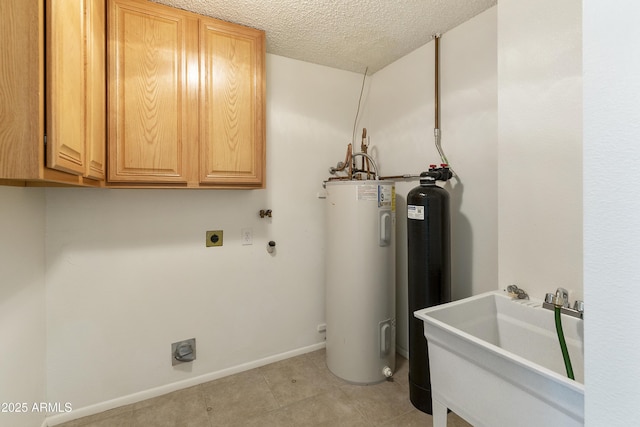 laundry area with sink, cabinets, electric dryer hookup, electric water heater, and a textured ceiling