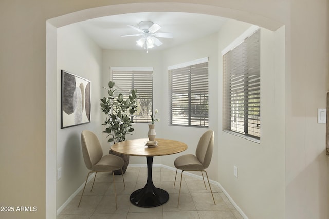 dining room with ceiling fan and light tile patterned floors