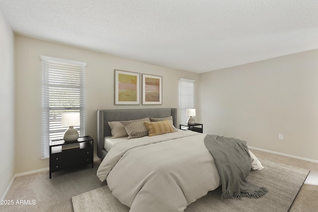 carpeted bedroom featuring a textured ceiling