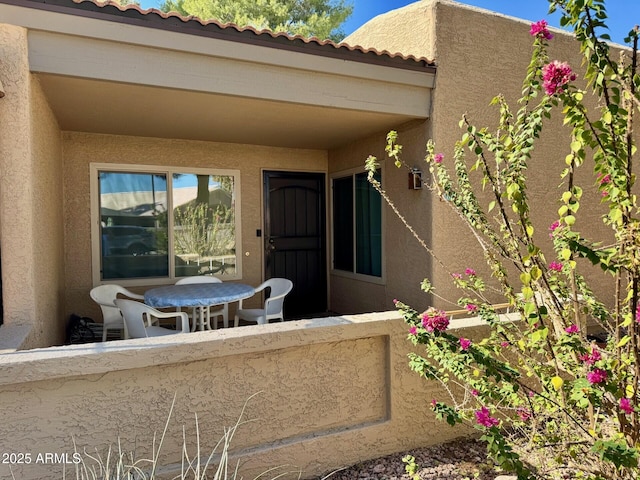 entrance to property with a balcony