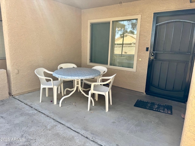 doorway to property with a patio area