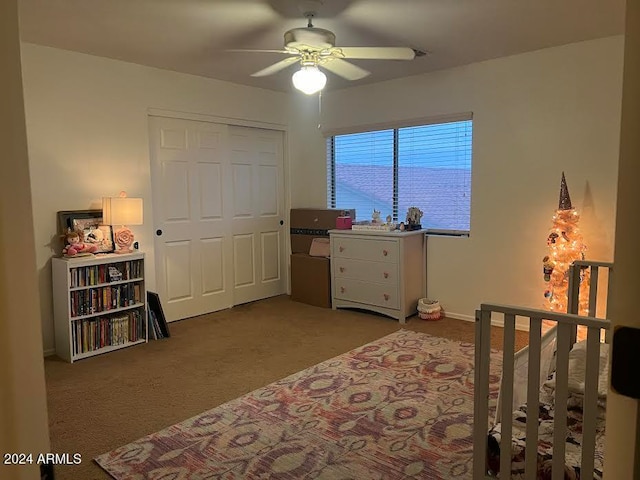 bedroom featuring carpet flooring, ceiling fan, and a closet