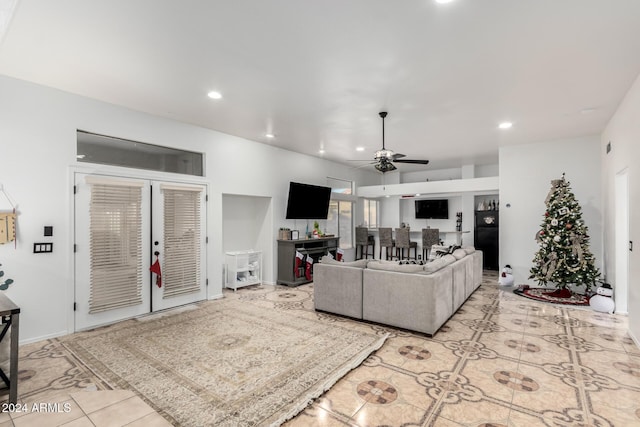 tiled living room with ceiling fan