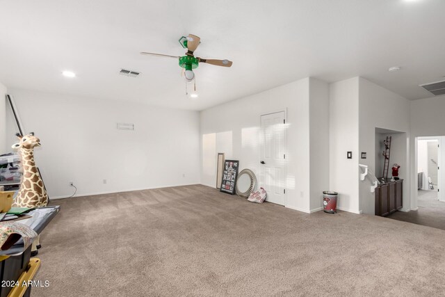 living room with ceiling fan and carpet floors