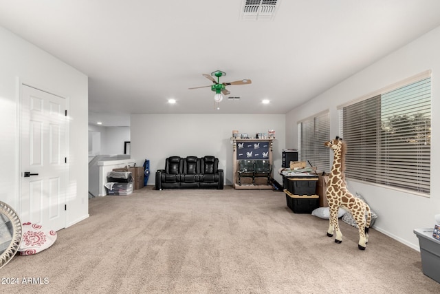 sitting room featuring carpet flooring and ceiling fan