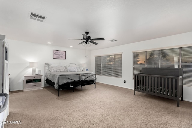 carpeted bedroom with ceiling fan