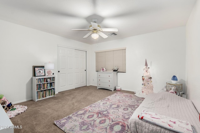 carpeted bedroom featuring a closet and ceiling fan