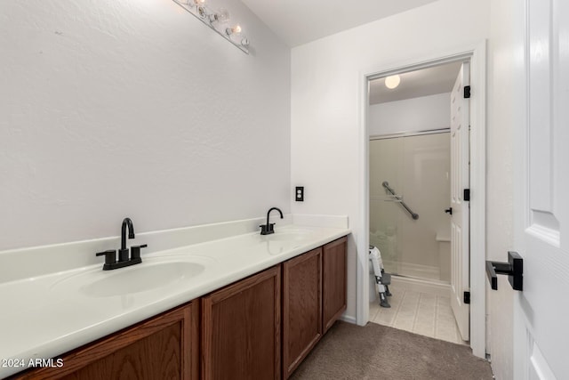 bathroom featuring a shower, tile patterned flooring, and vanity