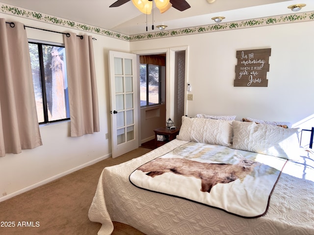 bedroom featuring vaulted ceiling and carpet floors