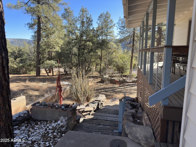 view of yard with a wooden deck