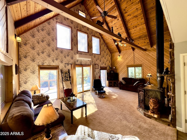 carpeted living room with ceiling fan, high vaulted ceiling, wooden ceiling, beamed ceiling, and a wood stove