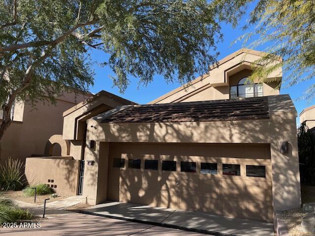 view of front of home with a garage