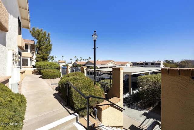 view of home's community with a residential view and fence