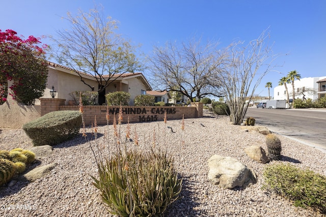 exterior space with a residential view and fence