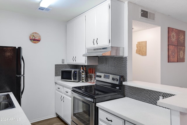 kitchen featuring dark wood-type flooring, sink, stainless steel appliances, decorative backsplash, and white cabinets