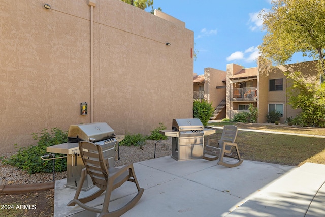 view of patio featuring stairway and grilling area