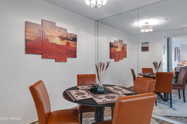 dining space with wood finished floors and baseboards