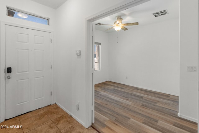 entrance foyer with ceiling fan and light hardwood / wood-style floors