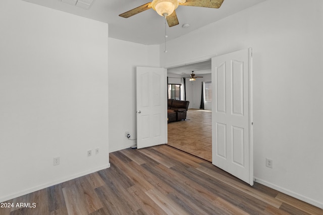 unfurnished bedroom featuring ceiling fan and hardwood / wood-style floors