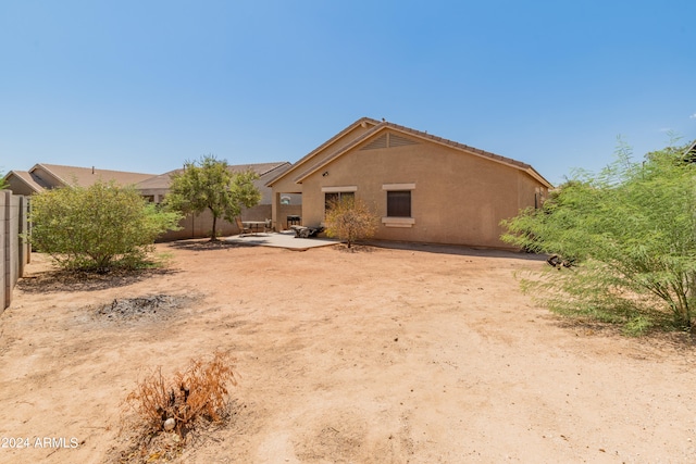 rear view of property featuring a patio