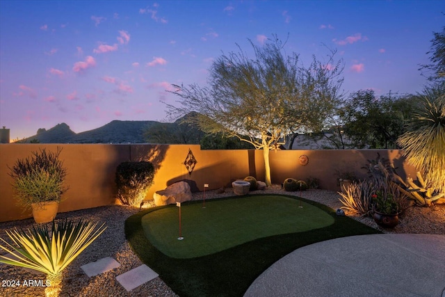 yard at dusk with a mountain view