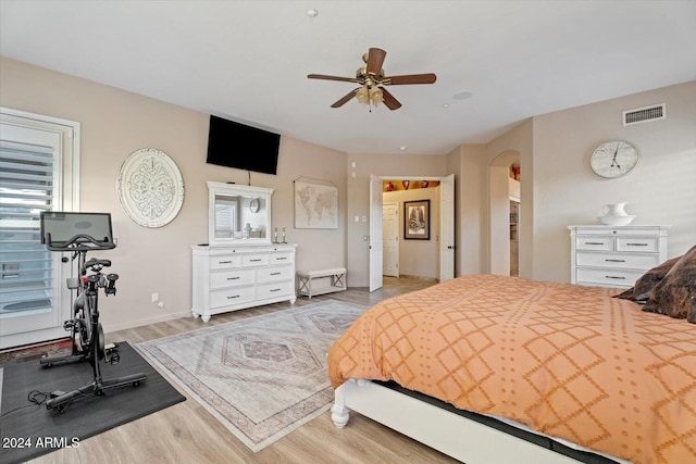 bedroom with ceiling fan and light hardwood / wood-style floors