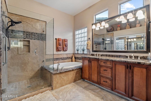 bathroom with vanity and plus walk in shower