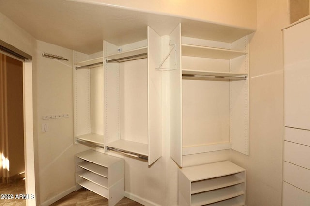 spacious closet featuring hardwood / wood-style flooring