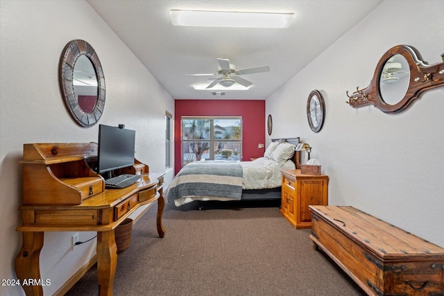 bedroom featuring dark colored carpet and ceiling fan